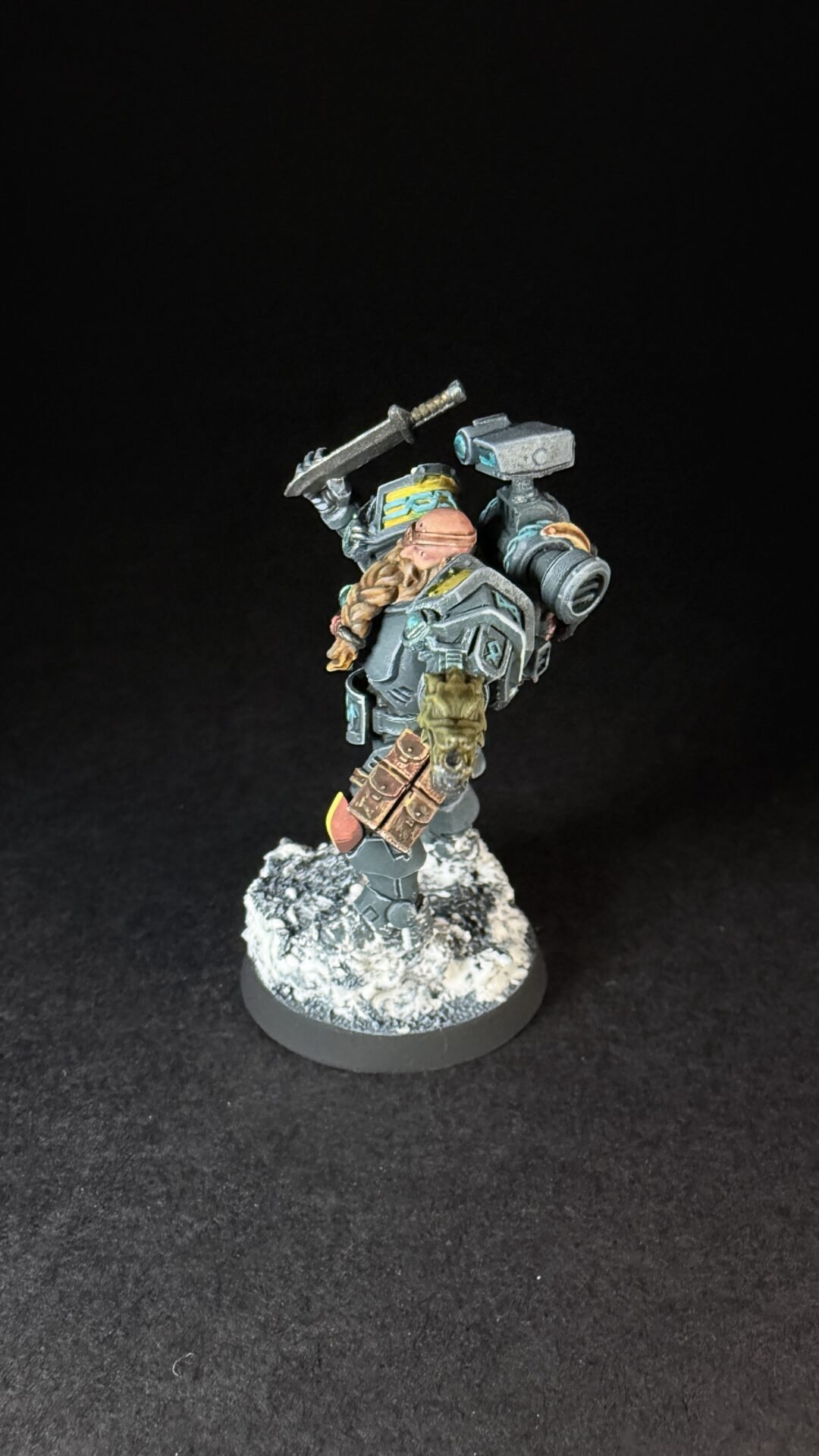 Painted Wolf Scout Hunter with Plasma Pistol and Combat Blade on snowy base.