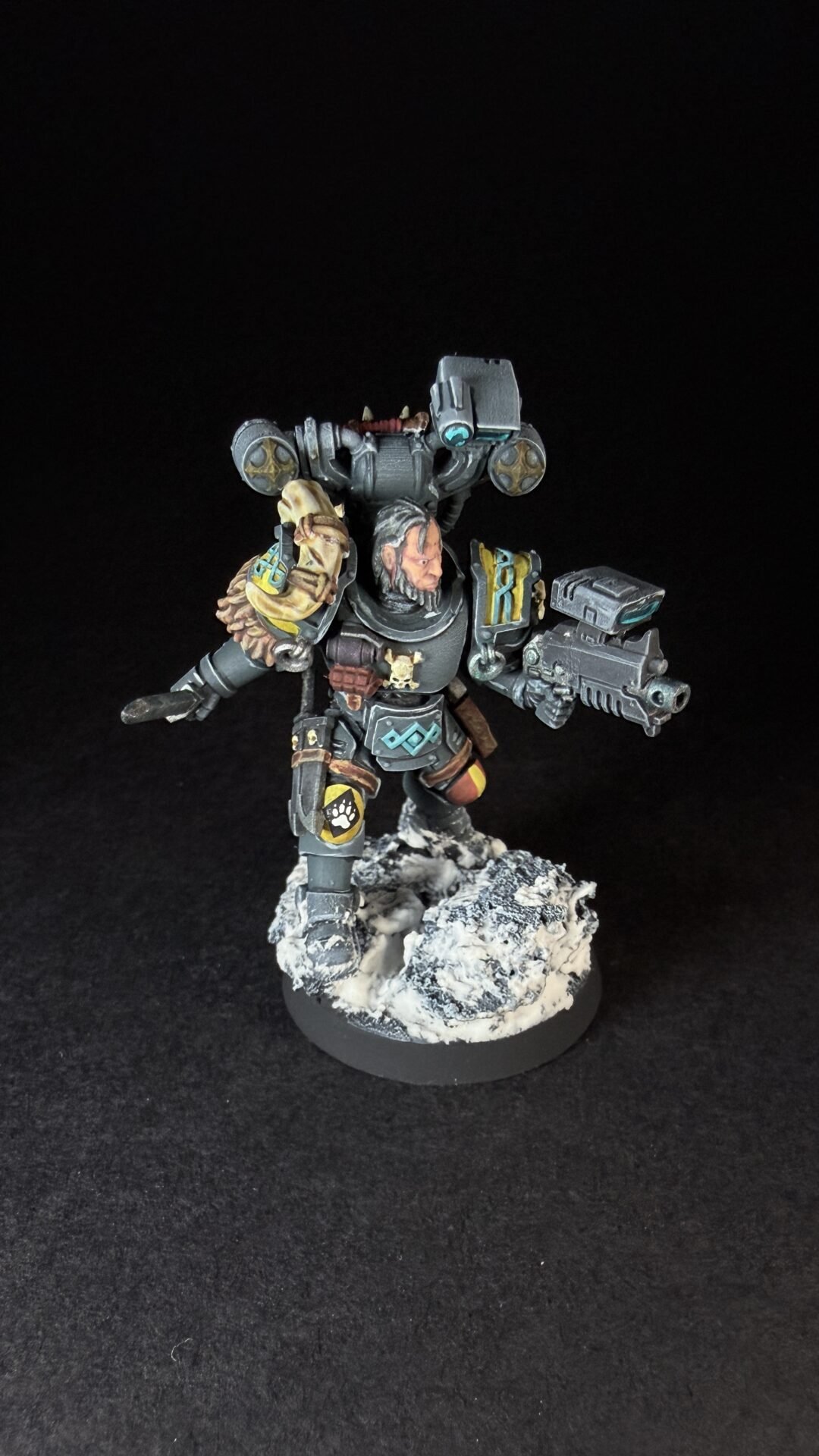 Painted Wolf Scout Fangbearer with Absolvor Bolt Pistol and Combat Blade on snowy base.