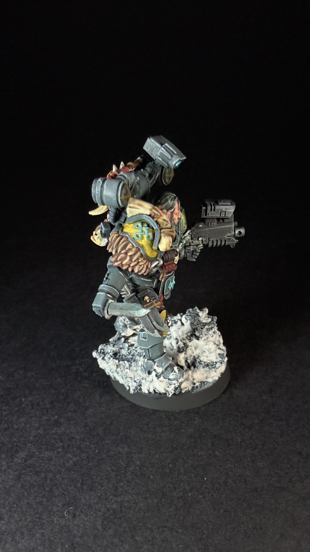 Painted Wolf Scout Fangbearer with Absolvor Bolt Pistol and Combat Blade on snowy base.