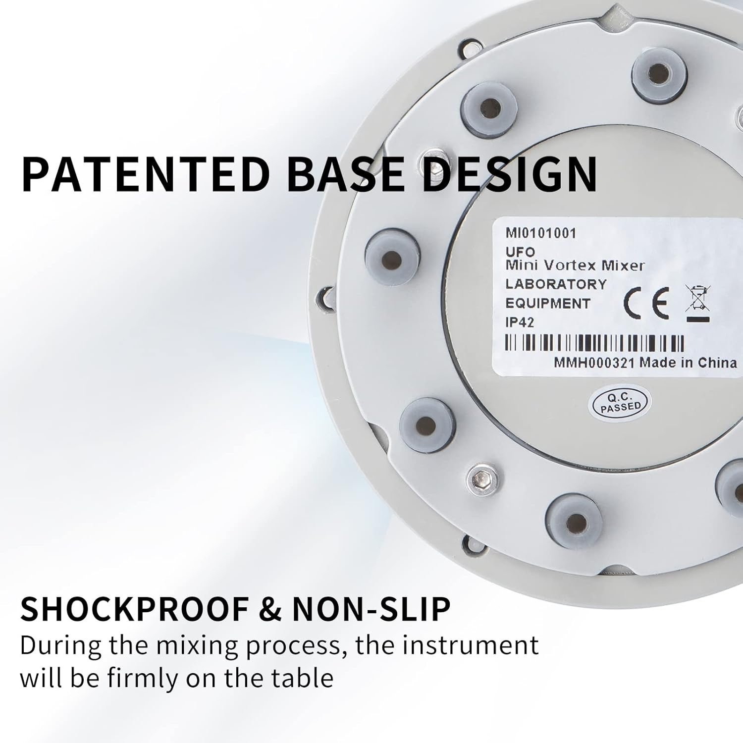 Close-up of a lab mixer base showing a label with 'PATENTED BASE DESIGN' and 'SHOCKPROOF & NON-SLIP'.